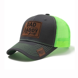 Mesh trucker hat in grey and neon green with DAD embroidered patch and curved brim