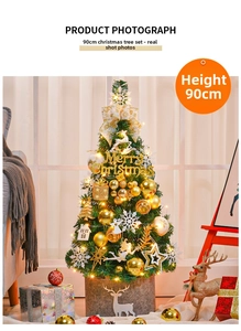 Detail view of a 90cm decorated Christmas tree with LED lights and golden ornaments