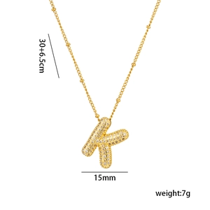 Detail of 18K gold plated K letter necklace with micro-pave cubic zirconia gemstones