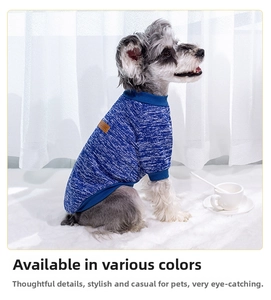 Close-up of blue knit pet sweater with rib-knit cuffs and classic leather brand patch