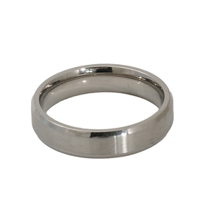 Detailed close-up of a minimalist silver titanium steel ring with a smooth polished finish