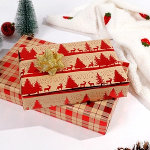 Christmas kraft paper gift box with gold bow, red reindeer and tree patterns