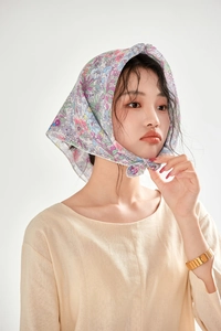 Close-up of floral cotton linen bandana tied on head with vintage flower pattern