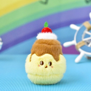 Macro detail view of a cute pudding plush toy with a red cherry topping decoration