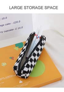 Macro detail of checkered knit storage bag showing large capacity for markers
