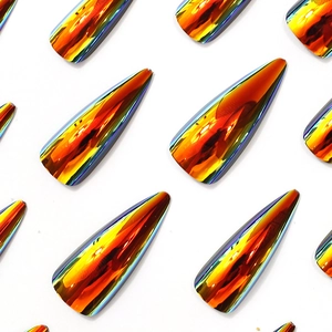 Metallic orange stiletto press-on nails with iridescent electroplated finish on white