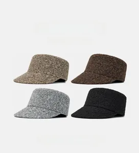 Detailed grid view of plush flat-top hats in four warm colors for winter styling