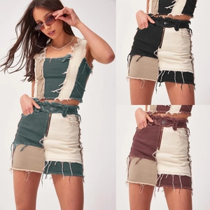 Detail view of denim two-piece sets with fringe hem and patchwork in multiple color options
