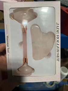 Detail of Rose Quartz facial roller and Gua Sha set in a display gift box package