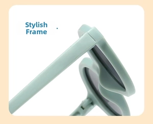 Detail shot of light green heart-shaped sunglasses featuring durable hinges and thick frames