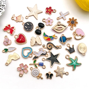 Detailed view of colorful enamel alloy pendants in various shapes for DIY jewelry making