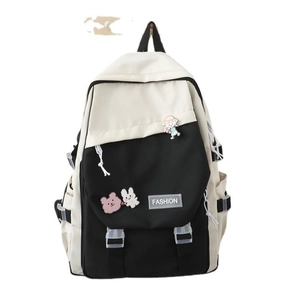 Fashionable black and white contrast backpack for women with cute cartoon badges