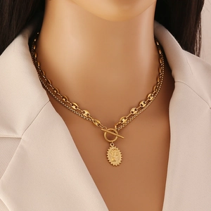 Double-layered gold stainless steel necklace with portrait medallion and toggle clasp