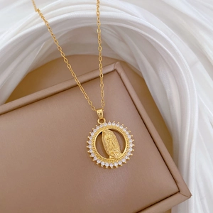 Luxurious gold stainless steel necklace featuring a crystal-encrusted Madonna pendant