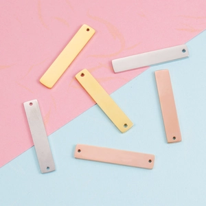 Polished rectangular stainless steel tag pendants in gold, silver, and rose gold finishes