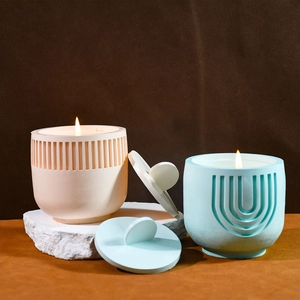 Detailed view of striped and U-shaped textured silicone candle jars with matching lids