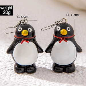 Macro view of penguin Christmas earrings with measurements 2.6cm by 5.5cm weighing 20g