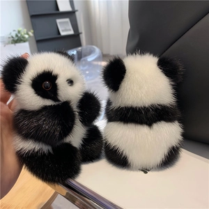 Detail of plush panda keychain featuring fluffy mink fur texture and realistic design