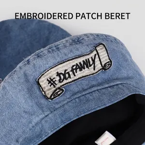 Blue denim beret hat with DG Family embroidered patch shown in a high-quality top view