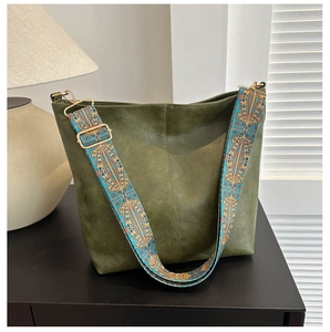Close-up of olive green tote bag featuring a vintage bohemian printed wide strap