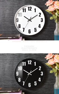 Detail of 12-inch silent wall clocks in black and white with 3D numbers for home decor
