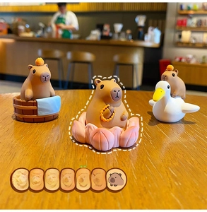 Three cute resin capybara figurines featuring meditation, bathing, and duck-riding poses