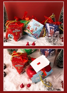 Detailed view of pyramid Christmas gift boxes with silk ribbons and festive scenery