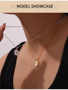 Model view of gold and silver stainless steel cross pendant necklaces on neck