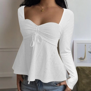 Elegant white long sleeve lace blouse featuring hollow embroidery and sweetheart neckline