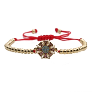 Adjustable golden beaded bracelet with colorful zircon octagon pendant and red cord