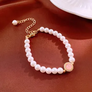 Bracelet de perles plaqué or avec pierre rose et zircons brillants pour femme