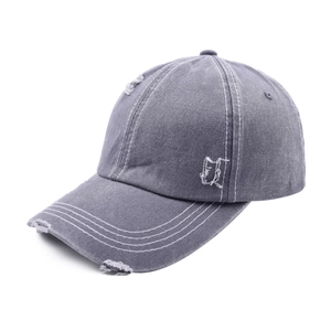 Detail of distressed dark grey baseball cap with white contrast stitching and ripped effects