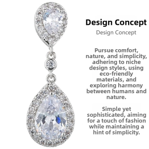 Macro detail of teardrop pear-cut zircon earrings with silver crystal halo settings