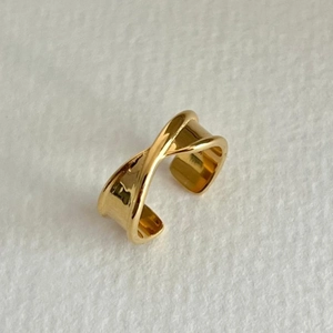 Polished gold 925 sterling silver ring featuring a modern irregular cross design