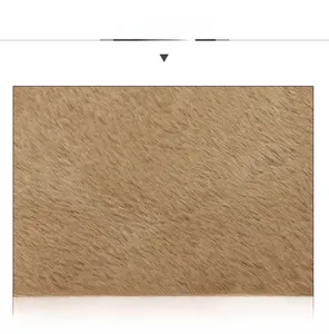 Close-up of thick brown faux fur texture showing soft plush fabric for winter hats