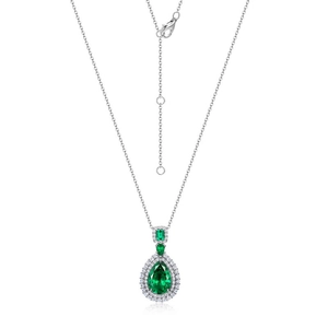 Vintage pear-cut emerald necklace with silver chain and halo diamond setting on white background