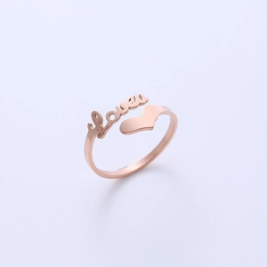 Rose gold heart open ring with LOVE lettering on a minimalist blue background