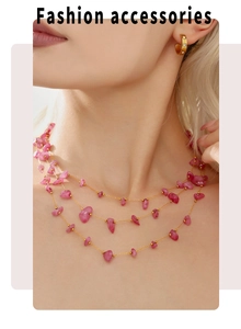 Close-up of bohemian layered necklace with pink natural stones and gold beaded chains