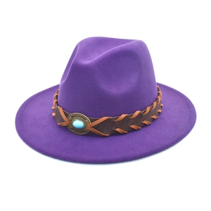 Detail of purple fedora hat with woven leather band and turquoise stone ornament