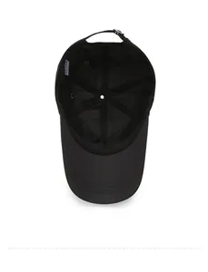 Detail of the black baseball cap interior showing sweatband and adjustable metal buckle