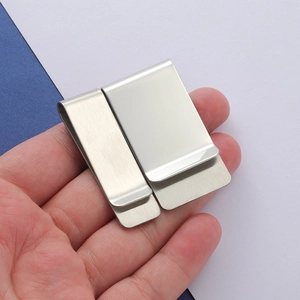 Polished stainless steel money clip detail showing two sizes with brushed metal finish