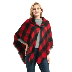 Women's red and black buffalo plaid poncho with toggle button and fringe details