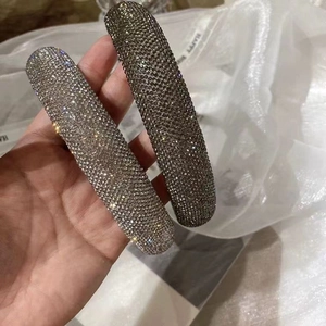 Sparkling rhinestone padded headbands in silver and dark grey for a high-volume look