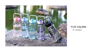 Outdoor shot of 2L large capacity sports bottles in five colors with straws and time markers