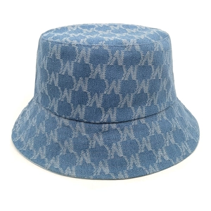 Close-up of blue washed denim bucket hat featuring all-over white 'W' letter pattern