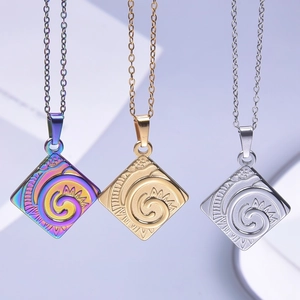 Three square stainless steel pendants with spiral sun patterns in gold, silver, and rainbow