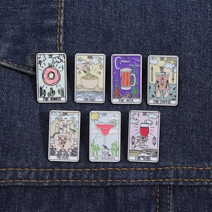 Set of 7 creative tarot-themed enamel pins with food and drink icons on denim fabric
