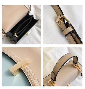 Détails du sac à main beige avec garnitures dorées et poignée renforcée sur tissu