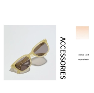 Detail of retro cream translucent sunglasses frame with stylish metal rivet accents
