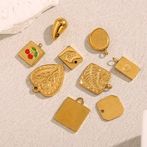 18K gold plated stainless steel pendants with heart, cherry, and rose designs on beige base